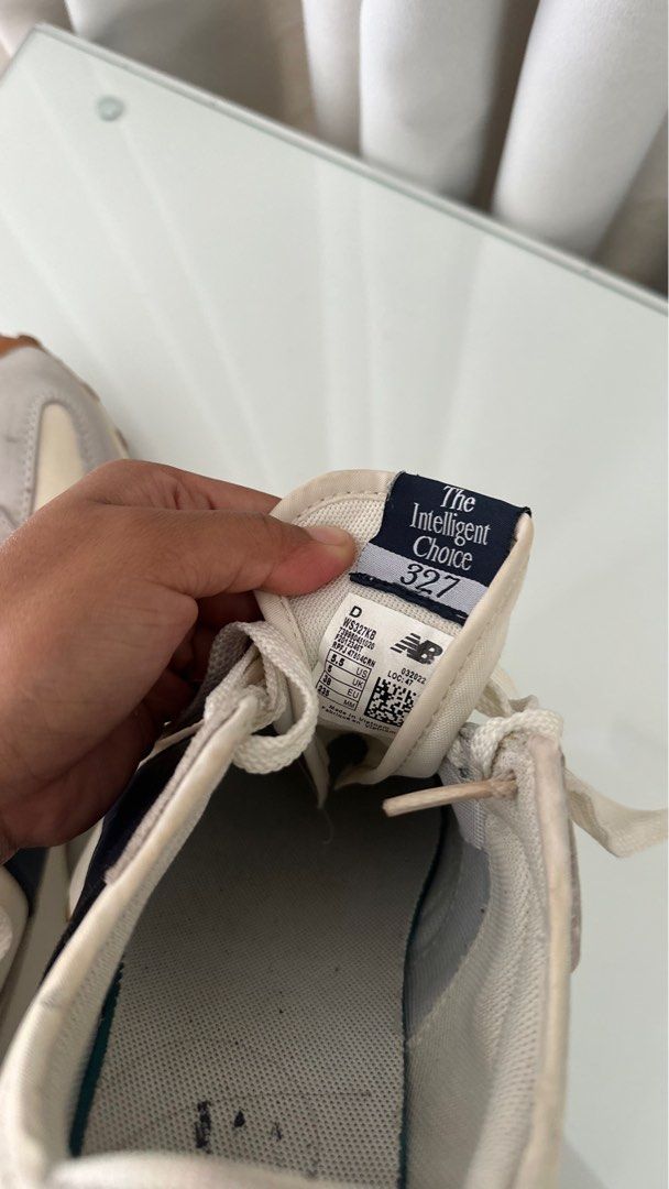 New Balance 327 Sneakers (Category: Sneakers) located in Santa Rosa. Submitted by declutterbydl (Listing ID 1421683093, Image 3). Description: - New Balance 327 - Cream and grey colorway - Navy blue logo - Size tag visible in photos - White laces - Brown sole.