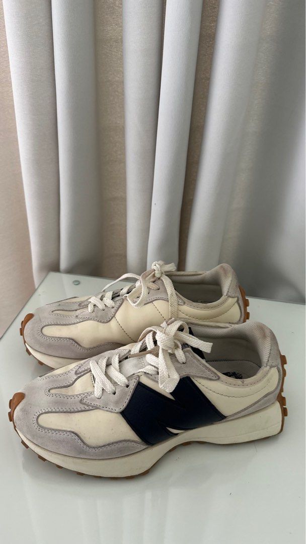 New Balance 327 Sneakers (Category: Sneakers) located in Santa Rosa. Submitted by declutterbydl (Listing ID 1421683093, Image 1). Description: - New Balance 327 - Cream and grey colorway - Navy blue logo - Size tag visible in photos - White laces - Brown sole.