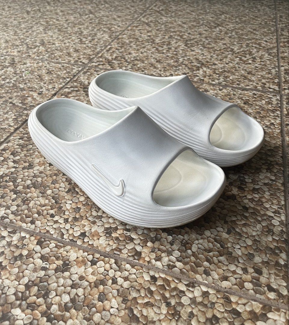 Nike Reactx Rejuven8 Slide (Category: Flats & Sandals) located in Bago City. Submitted by -xqk- (Listing ID 1421619048, Image 1). Description: - White Nike Offcourt slide sandals - Features the iconic Nike swoosh logo - Textured footbed for added comfort - Excellent grip and traction - Size indicated on the inside - Made in Indonesia.