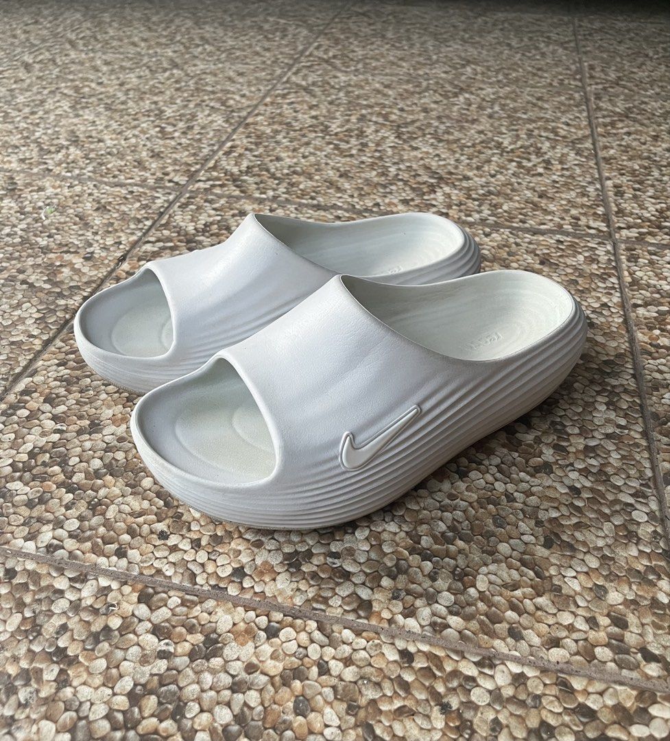 Nike Reactx Rejuven8 Slide (Category: Flats & Sandals) located in Bago City. Submitted by -xqk- (Listing ID 1421619048, Image 2). Description: - White Nike Offcourt slide sandals - Features the iconic Nike swoosh logo - Textured footbed for added comfort - Excellent grip and traction - Size indicated on the inside - Made in Indonesia.