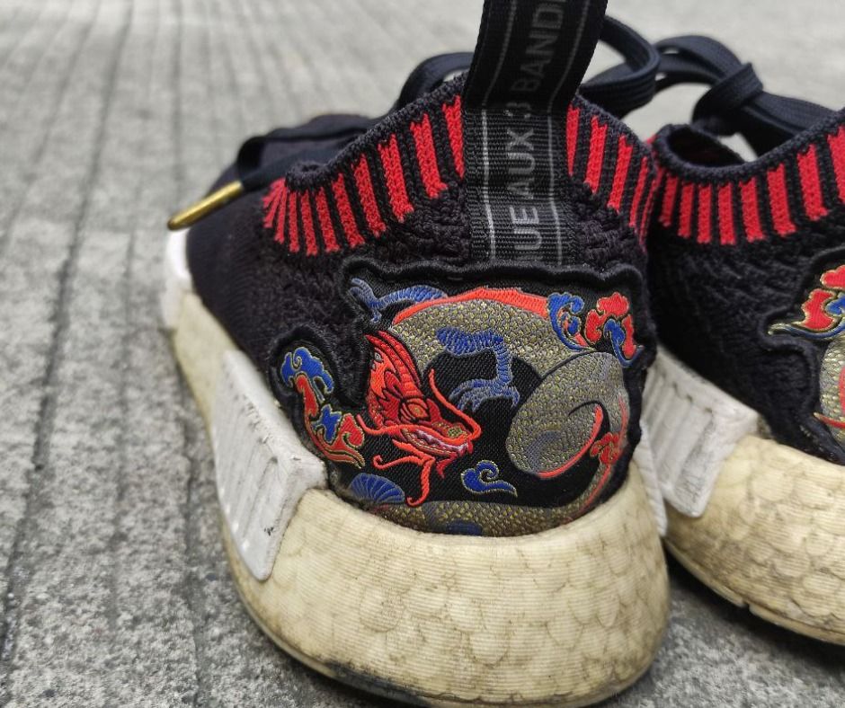 NMD R1 Dragon Boat (Category: Casual Shoes) located in Las Pinas. Submitted by jae.eaj (Listing ID 1421726973, Image 3). Description: NMD R1 Dragon Boat - Still in great shape - All designs in tact Issues: - Yellowing of boost - Needs cleaning Size: 6.5 mens (can fit 7 mens).