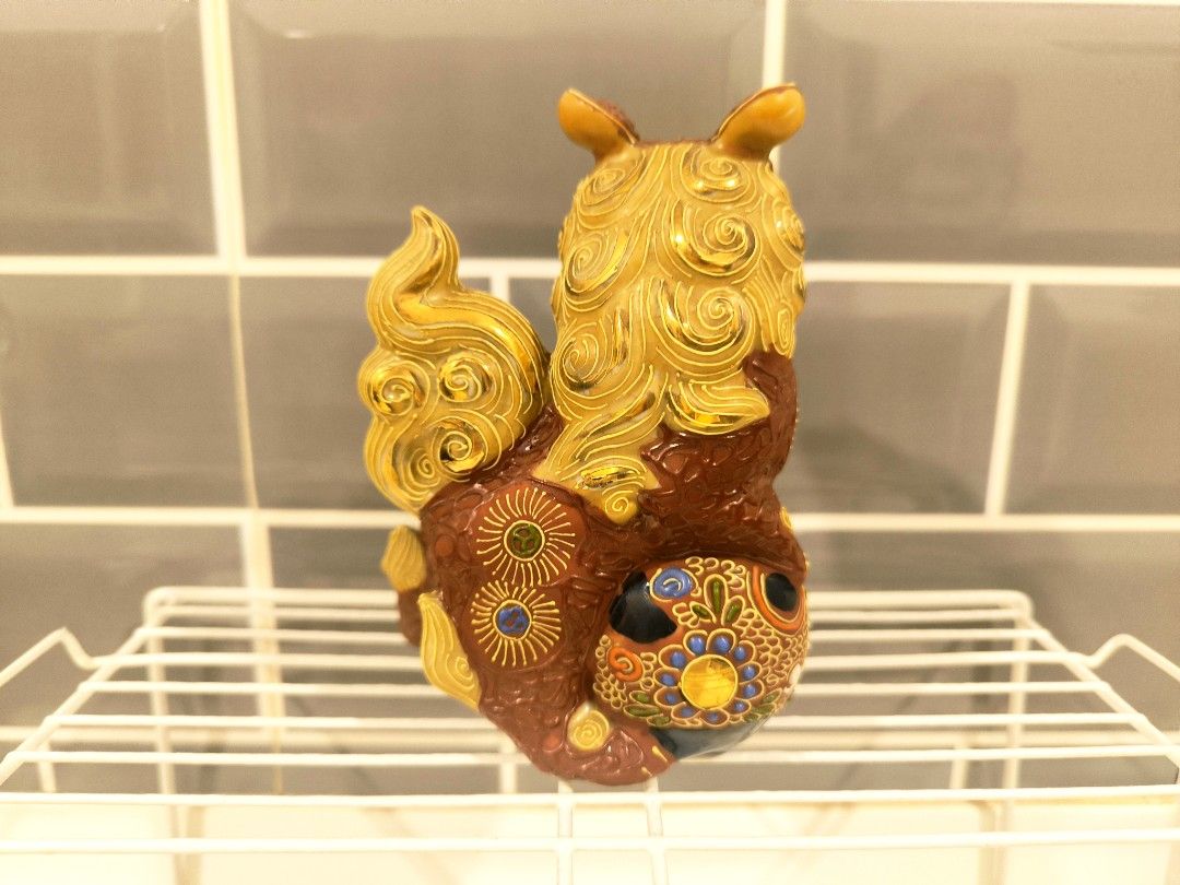 Kutani Ware Shishi Foo Dog (Vintage) (Category: Other Home Decor) located in Quezon City. Submitted by rbdy01 (Listing ID 1421634778, Image 2). Description: - Ishikawa prefecture Shishi figurine - Detailed design with vibrant colors - Golden mane and tail - Rich brown body with colorful accents - Signed (Kutani) ware - Unique collectible item - Base has markings - Vintage (possible meiji era to mid 20th century) in excellent condition price: 14,9