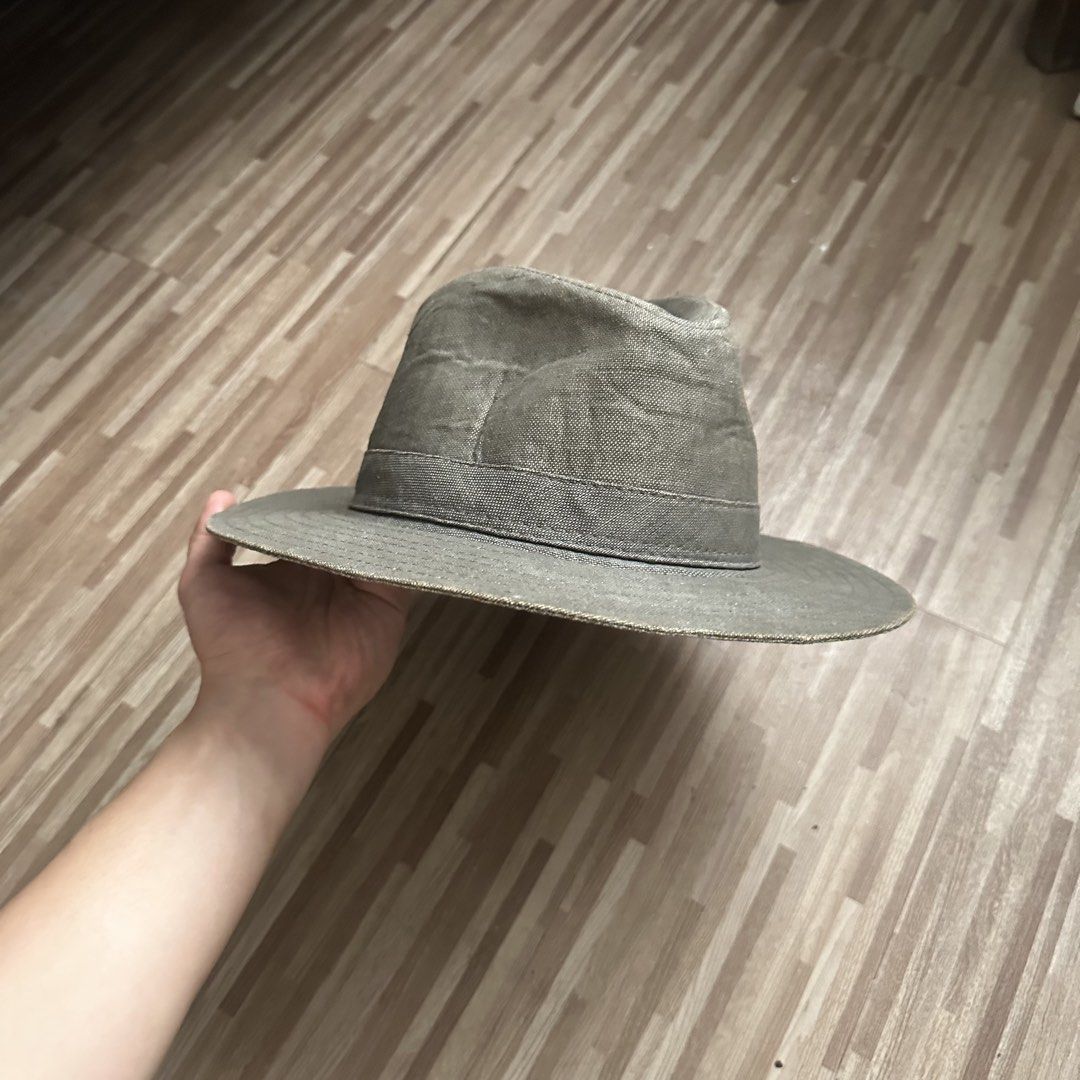 Olive Green Fedora Hat (Category: Caps & Hats) located in Marilao. Submitted by extra_stuff (Listing ID 1421631547, Image 2). Description: - Classic fedora hat - Wide brim - Structured crown - Olive green color - Textured fabric - Versatile accessory.