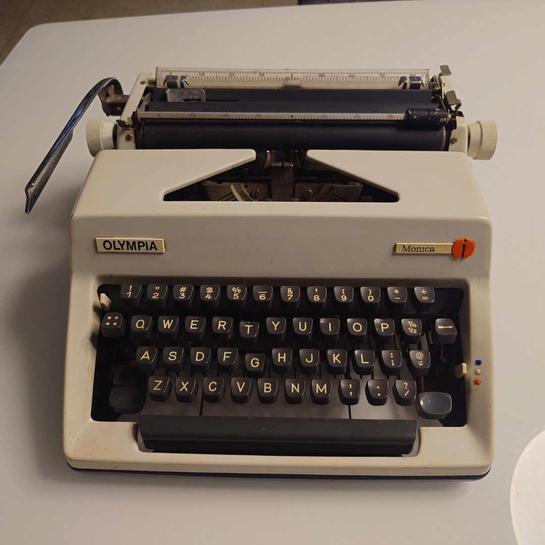 Olympia Monica Typewriter (Category: Office & Business Technology) located in Makati City. Submitted by ppomidyar (Listing ID 1421691901, Image 1). Description: - Vintage Olympia Monica typewriter - QWERTY keyboard - Cream-colored body with black keys - Includes carrying case - Made in Western Germany - Black carrying case with handle and lock - Olympia International logo visible - Made in West Germany - circa 1964-1972 model before German unific
