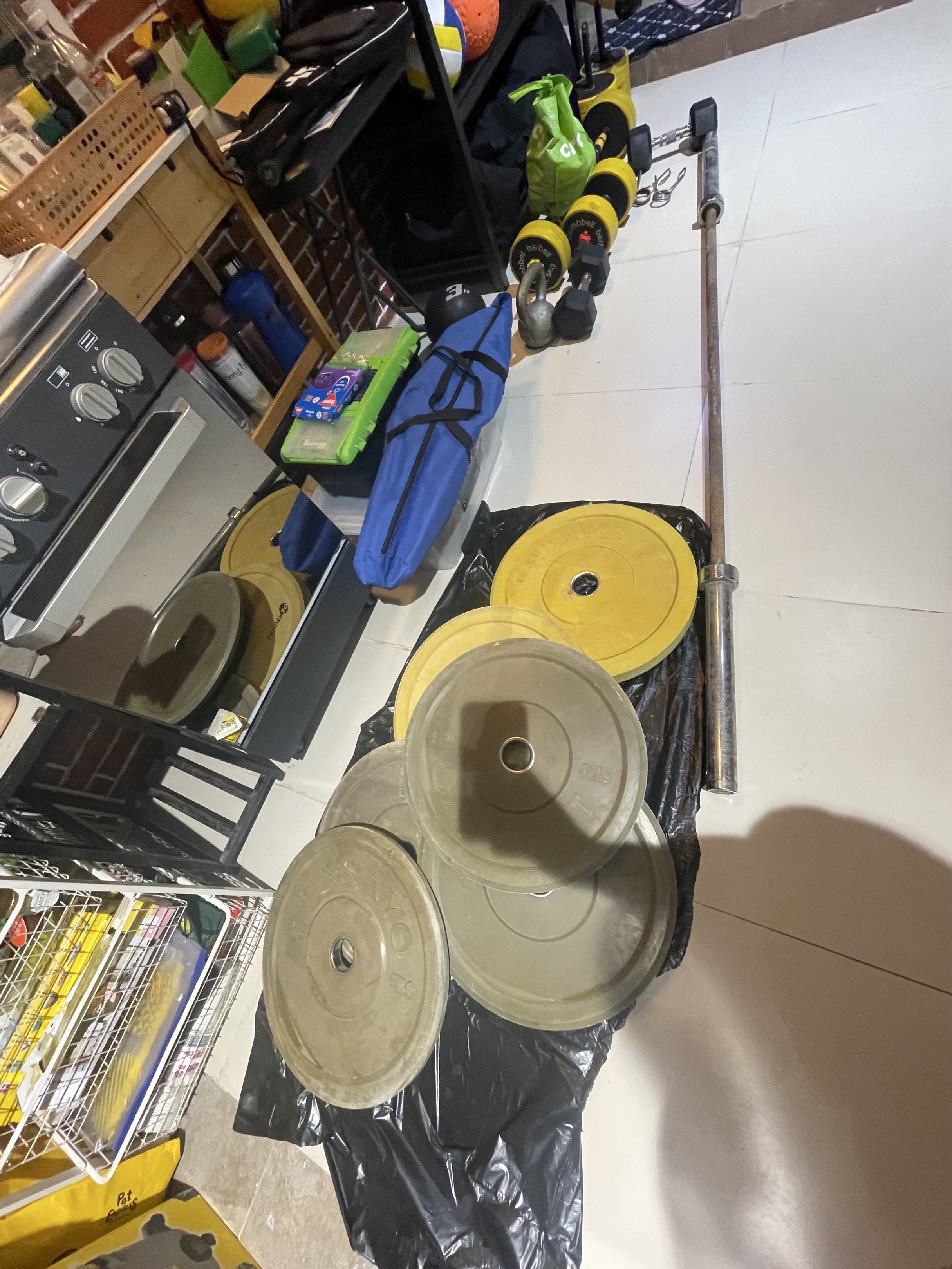 Olympic Weight Plates Set (Category: Weights & Dumbbells) located in Quezon City. Submitted by tabbybabby (Listing ID 1421719277, Image 1). Description: - Olympic weight plates and barbell set - Includes 5kg plates and yellow plates - Perfect for home gym - Suitable for various weightlifting exercises.