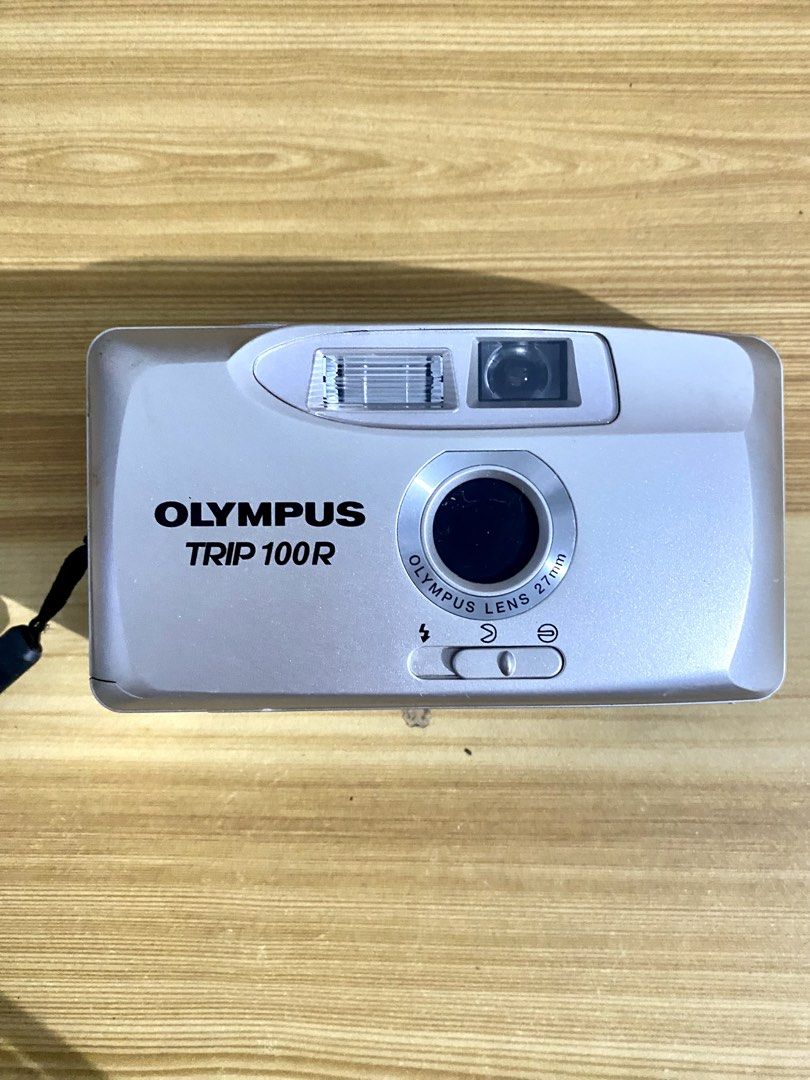 Olympus Trip 100R 35mm Film Camera (Category: Cameras) located in Manila. Submitted by GSCloset (Listing ID 1421748984, Image 1). Description: For Sale: Olympus Trip 100R 35mm film camera Untested - no battery and do not have film - 27mm lens - Built-in flash - Silver and gray body - Includes wrist strap - Made in Japan RFS: Decluttering LOC: Cubao, Quezon City Can do same day delivery Payment method: GCASH.
