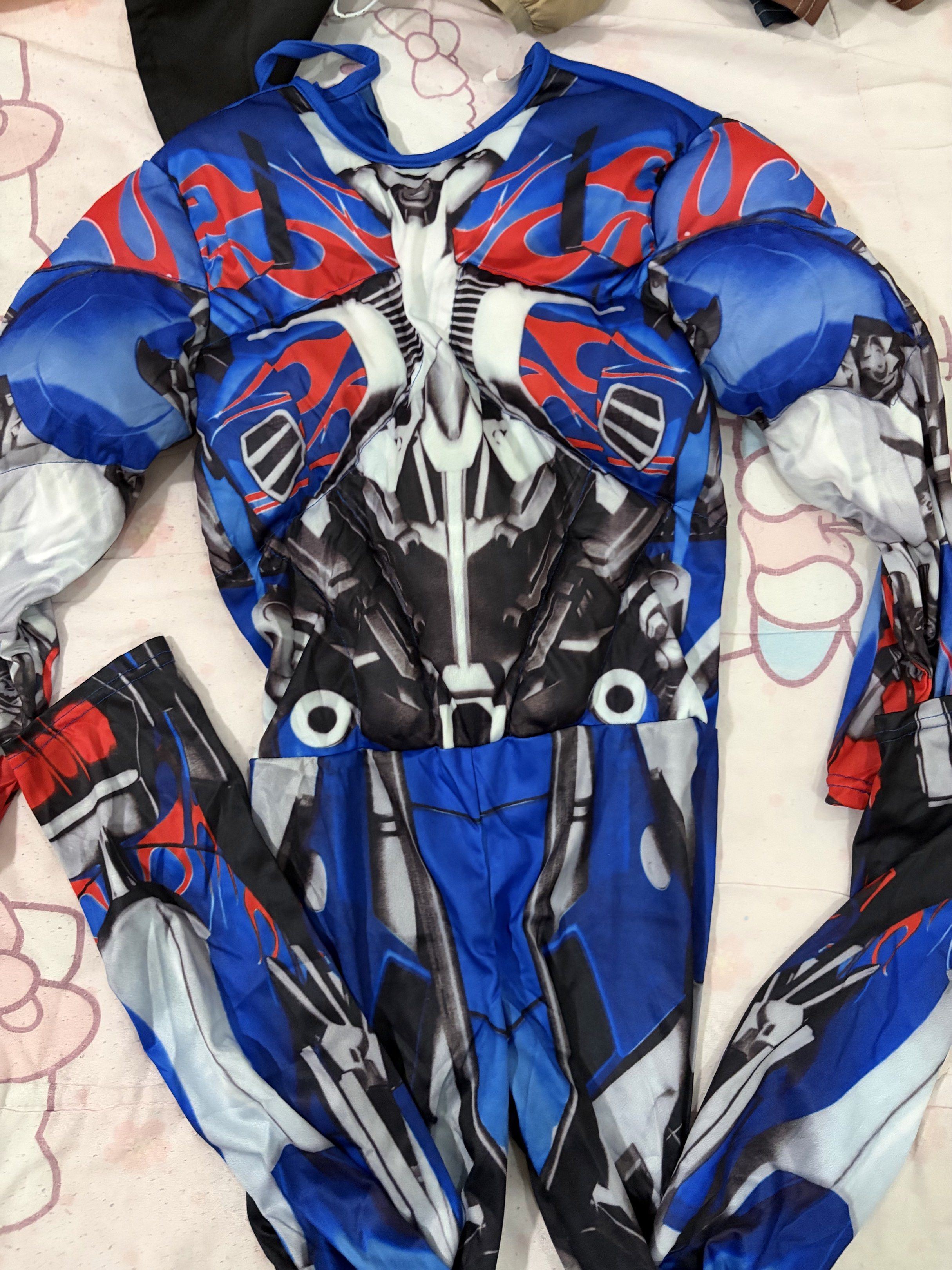 Optimus Prime Costume with Mask (Category: Babies & Kids Fashion) located in Manila. Submitted by chaesielle (Listing ID 1421698279, Image 1). Description: THIS IS TOP & BOTTOM! Note: Isang diretso ‘yung pag suot niya. - Optimus Prime costume set - Includes full body suit and mask - Features iconic blue, red, and silver design - Detailed mask with silver and blue accents - Perfect for cosplay and themed events.