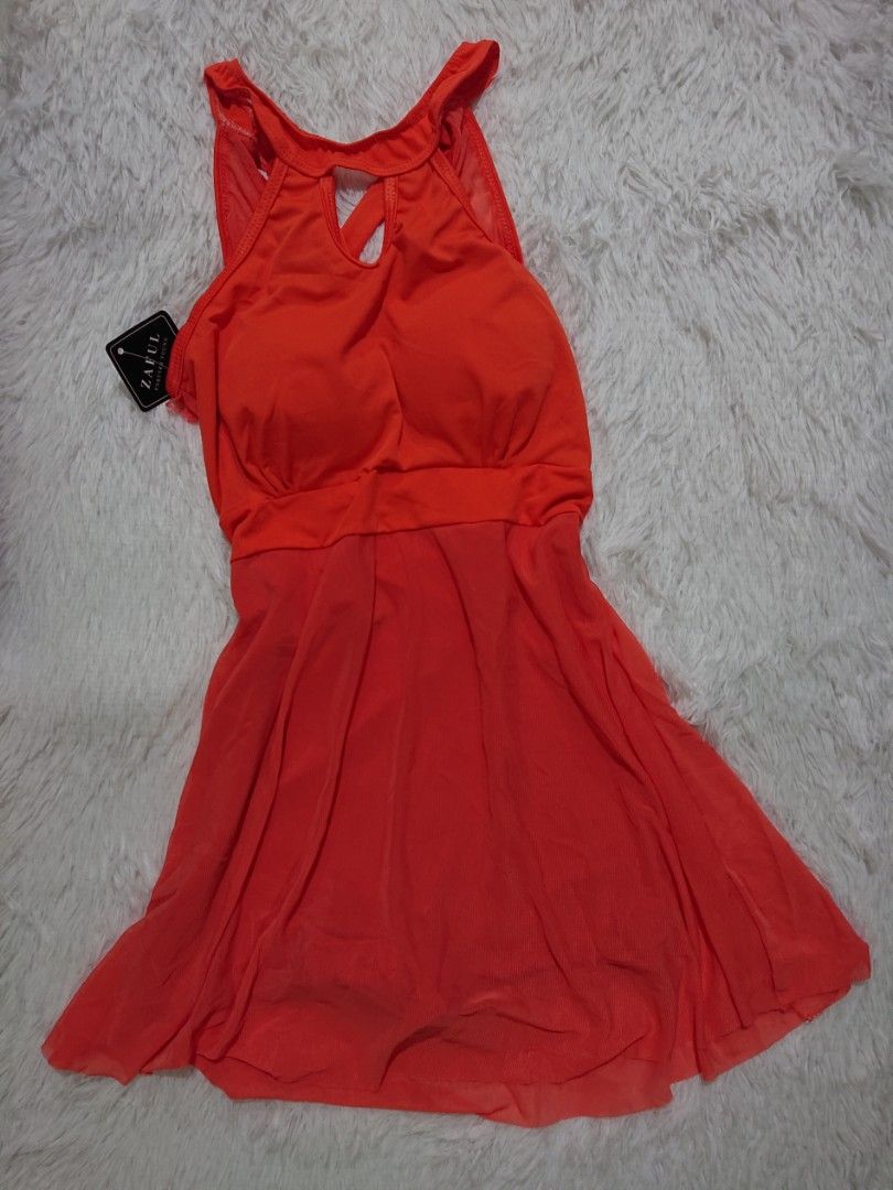 Orange Swimsuit small size (Category: Bikinis & Swimsuits) located in Cavite. Submitted by theresa16 (Listing ID 1421782939, Image 1). Description: - Bright orange swimsuit - Halter neck design - Keyhole back detail - Fitted bodice - Flowing skirt - Lightweight, possibly sheer fabric - Brand new with tag.