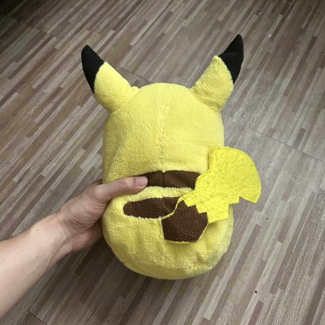 Pikachu Plush Toy (Category: Plushies & Soft Toys) located in Marilao. Submitted by extra_stuff (Listing ID 1421631596, Image 2). Description: - Authentic Pikachu plush toy - Iconic yellow and black design - Features Pikachu embroidery - Includes a tail - Soft and cuddly material - Great for collectors and kids!.