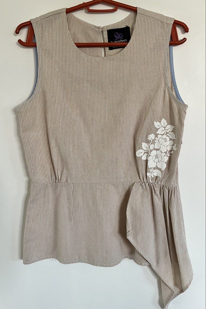 Plains & Prints Striped Sleeveless Top (Category: Sleeveless) located in San Fernando. Submitted by 4ases.declutter (Listing ID 1421638605, Image 1). Description: - Plains & Prints sleeveless top - Beige and white striped pattern - Asymmetrical design - Side zipper closure - Keyhole back detail - Floral embellishment - Size: PHL XS, EUR 6, USA 2.