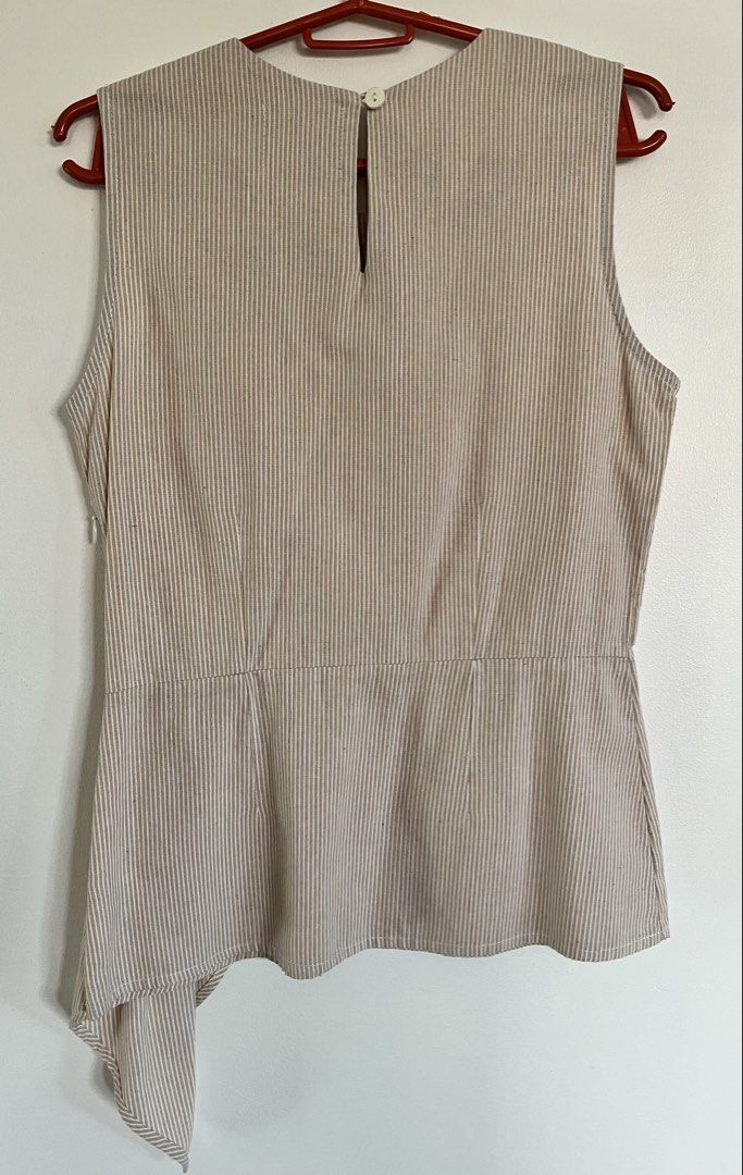Plains & Prints Striped Sleeveless Top (Category: Sleeveless) located in San Fernando. Submitted by 4ases.declutter (Listing ID 1421638605, Image 2). Description: - Plains & Prints sleeveless top - Beige and white striped pattern - Asymmetrical design - Side zipper closure - Keyhole back detail - Floral embellishment - Size: PHL XS, EUR 6, USA 2.