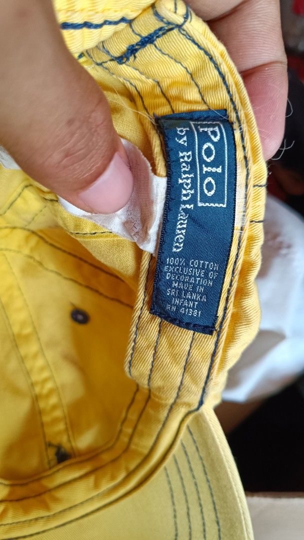 Polo by Ralph Lauren Yellow Cap (Category: Babies & Kids Fashion) located in Cagayan de Oro. Submitted by tryzumclothing292513 (Listing ID 1421625208, Image 3). Description: - Authentic Polo by Ralph Lauren cap - Color: Yellow - Features the iconic polo player logo - "POLO" embroidered on the back - Material: 100% cotton - Includes original tags - Made in Sri Lanka - INFANT SIZE.