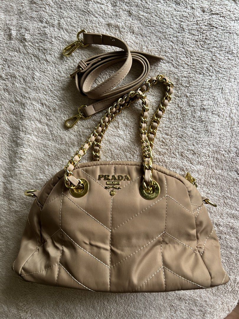 Prada Quilted Chain Bag (Category: Luxury Bags & Wallets) located in Dipolog. Submitted by sleek.wardrobe (Listing ID 1421627438, Image 1). Description: - Prada quilted handbag - Includes chain strap and adjustable strap - Gold-tone logo and hardware - Main compartment and interior pocket - Neutral color, versatile for any outfit.