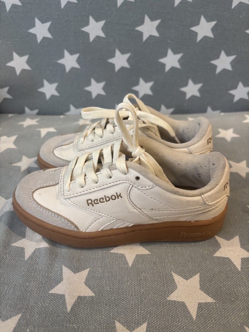 Reebok Sneakers (Category: Babies & Kids Fashion) located in Quezon City. Submitted by jcs_items (Listing ID 1421641288, Image 2). Description: - Cream-colored Reebok sneakers - Suede toe cap - Brown soles - Reebok logo on side and heel - Cream-colored laces Size: US 12k.