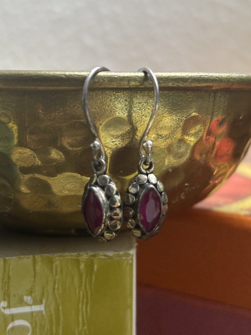 Ruby Drop Earrings (Category: Earrings) located in Singapore. Submitted by preesloved (Listing ID 1421764519, Image 2). Description: - Silver drop earrings - Ruby-colored stone - Unique textured border - Adds elegance to any outfit.