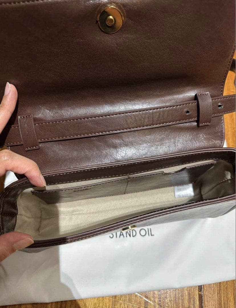 Stand Oil (Category: Shoulder Bags) located in Manila. Submitted by mdeclutterrr (Listing ID 1421653036, Image 3). Description: Stand Oil Bag (korean brand) Model: Butter Bag Classic Color: Maroon (“marron” on website) Bought in Korea Price is negotiable Used 1x (10/10 condition) Can be used as clutch, shoulder bag, crossbody bag Inclusions: Detachable long crossbody strap Dust bag .