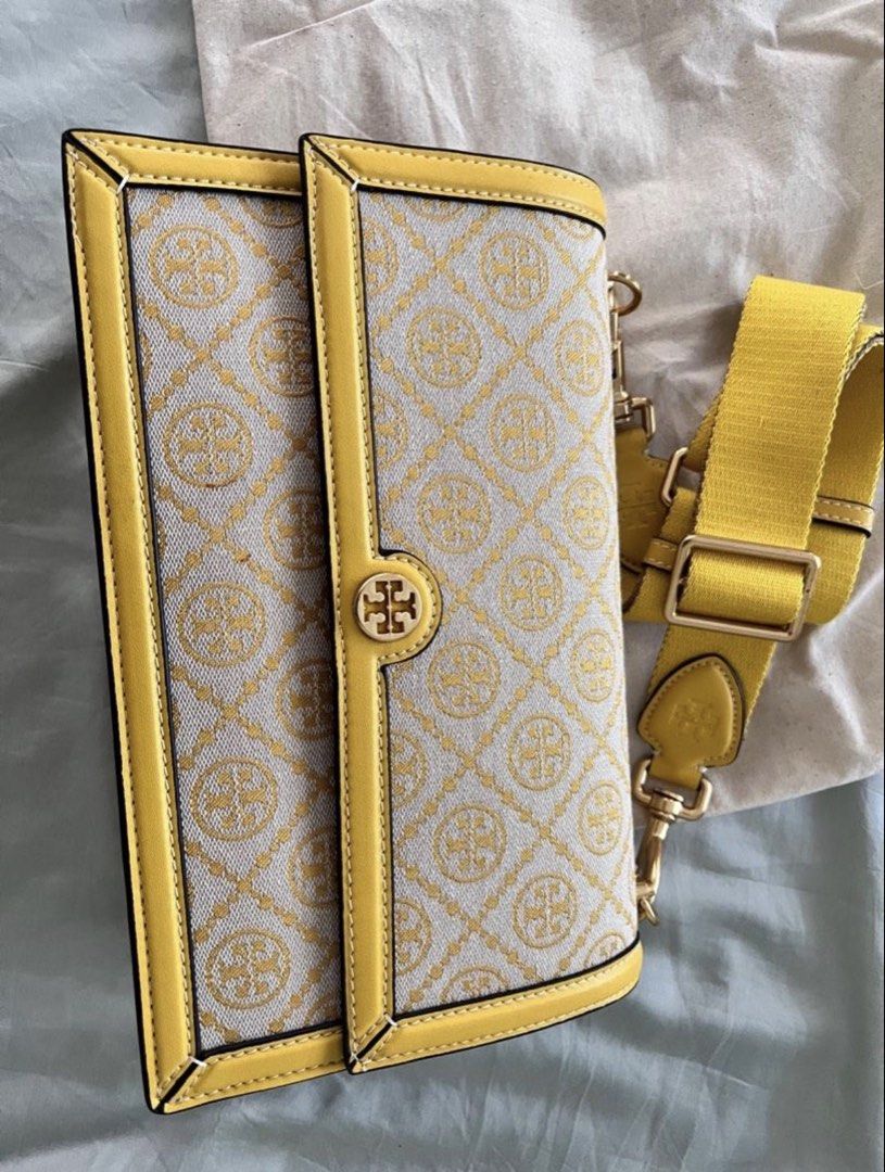 Tory Burch Monogram Jacquard Shoulder Bag (Category: Luxury Bags & Wallets) located in Cainta. Submitted by jhobreggy (Listing ID 1421733643, Image 2). Description: - Tory Burch Kira Chevron shoulder bag - Eye-catching yellow and cream chevron pattern - Matching yellow strap - Secure flap closure with gold-tone logo - Comes with dust bag and tag - Interior with multiple compartments - Rarely used; tag still intact.
