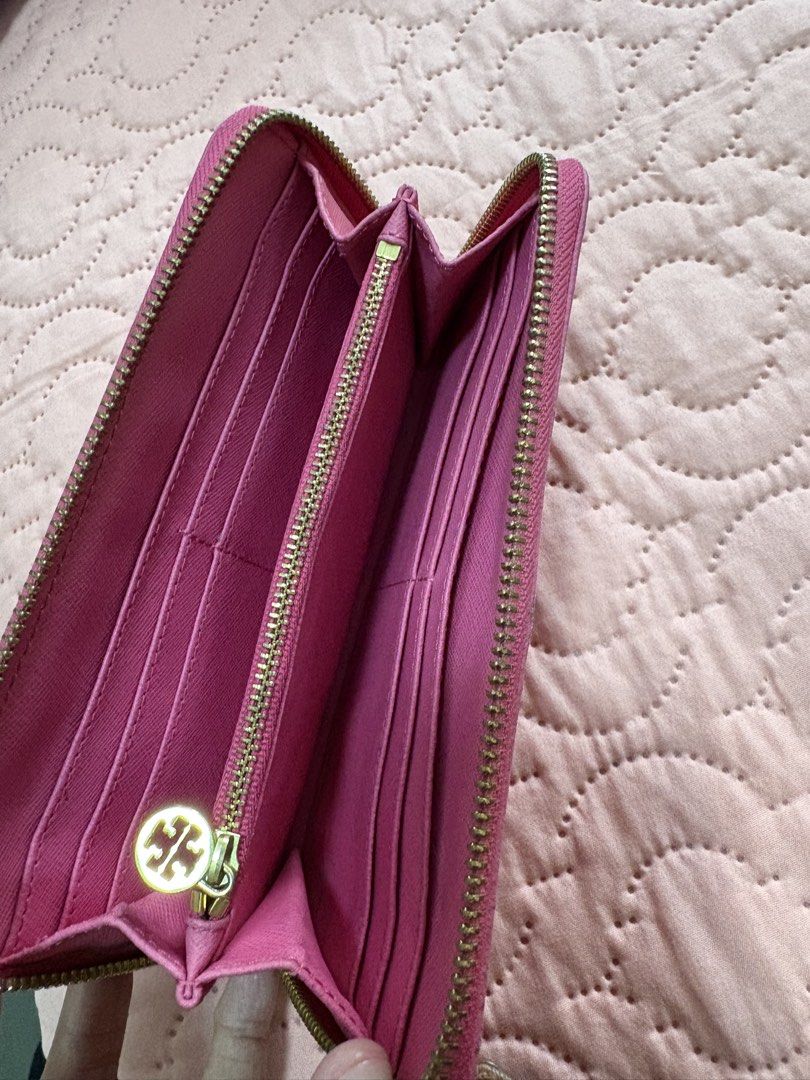 Tory Burch Zip Around Wallet (Category: Wallets & Card holders) located in Batangas. Submitted by elmpreloved_81 (Listing ID 1421643369, Image 3). Description: - Authentic Tory Burch wallet - Vibrant pink color - Gold-tone zipper and logo - Multiple card slots and compartments - Made of leather - Secure zip closure.