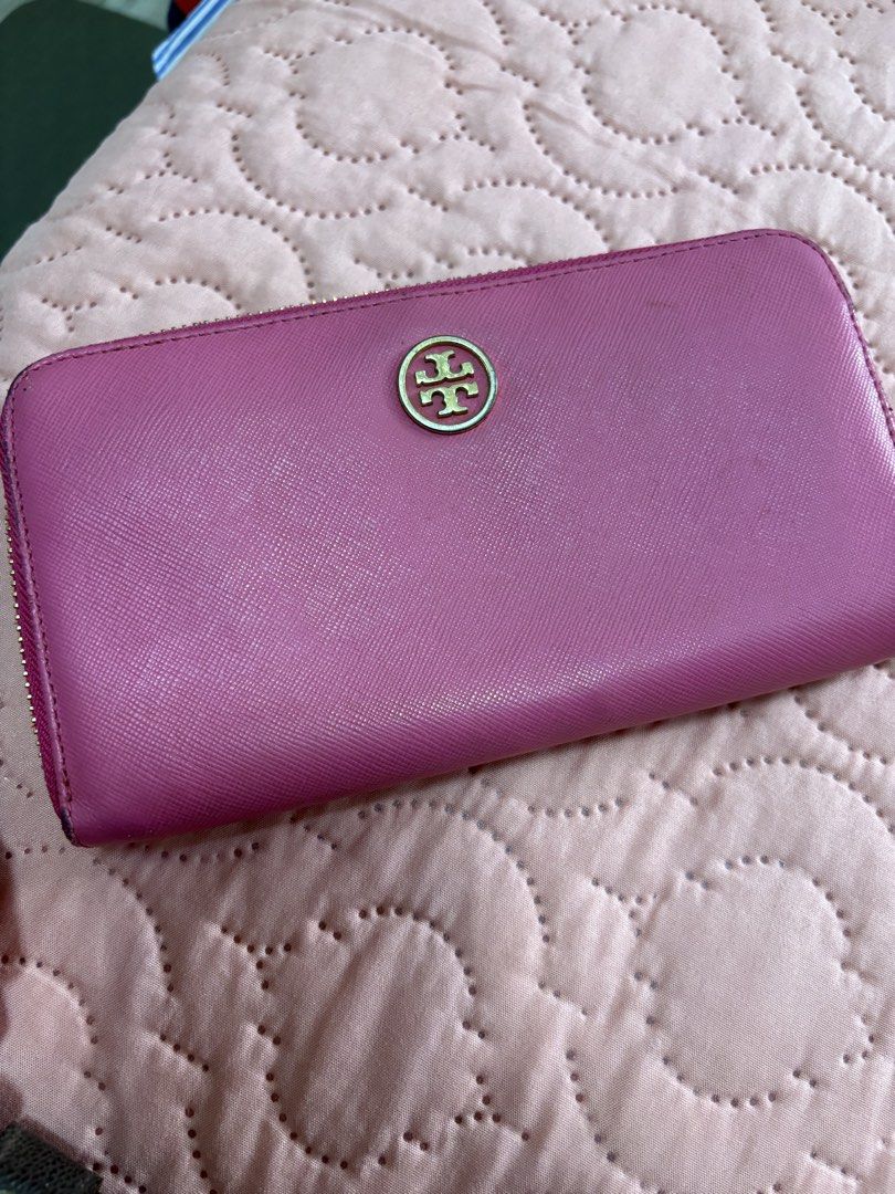 Tory Burch Zip Around Wallet (Category: Wallets & Card holders) located in Batangas. Submitted by elmpreloved_81 (Listing ID 1421643369, Image 1). Description: - Authentic Tory Burch wallet - Vibrant pink color - Gold-tone zipper and logo - Multiple card slots and compartments - Made of leather - Secure zip closure.