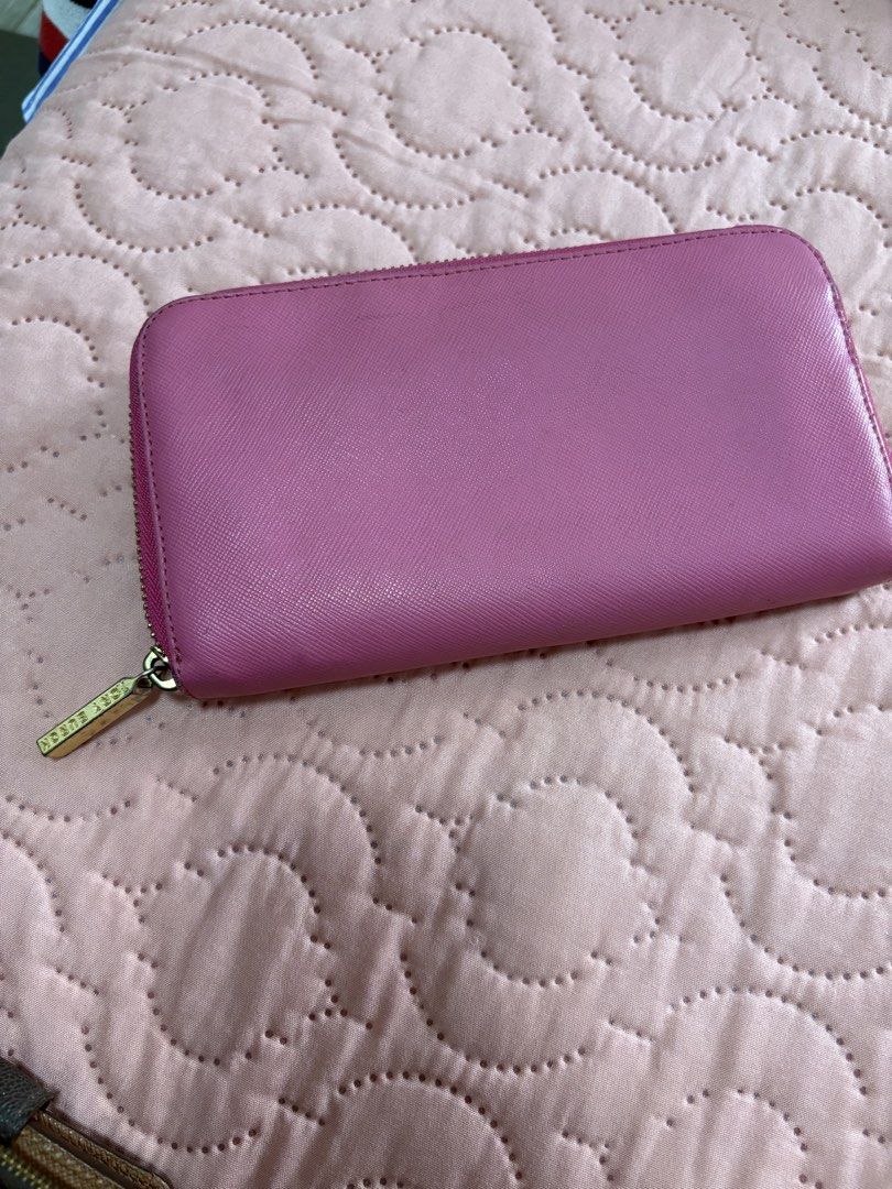 Tory Burch Zip Around Wallet (Category: Wallets & Card holders) located in Batangas. Submitted by elmpreloved_81 (Listing ID 1421643369, Image 2). Description: - Authentic Tory Burch wallet - Vibrant pink color - Gold-tone zipper and logo - Multiple card slots and compartments - Made of leather - Secure zip closure.