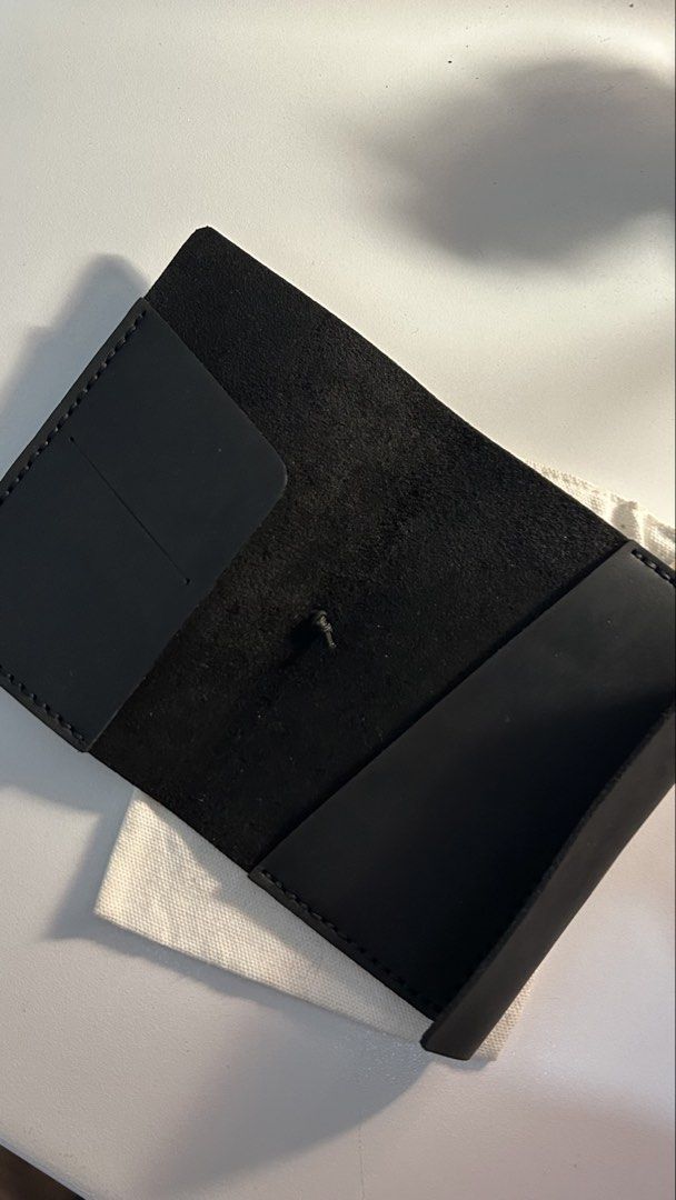 Trifold Genuine Leather Passport Size Journal (Category: Luxury Bags & Wallets) located in Calamba. Submitted by horibuys (Listing ID 1421745038, Image 2). Description: - Black leather passport size cover - Genuine cowhide OPU leather - Fits passport and fieldnotes size - Elastic closure - Multiple interior pockets for cards and ephemera - Includes a canvas storage pouch Handmade with love!.