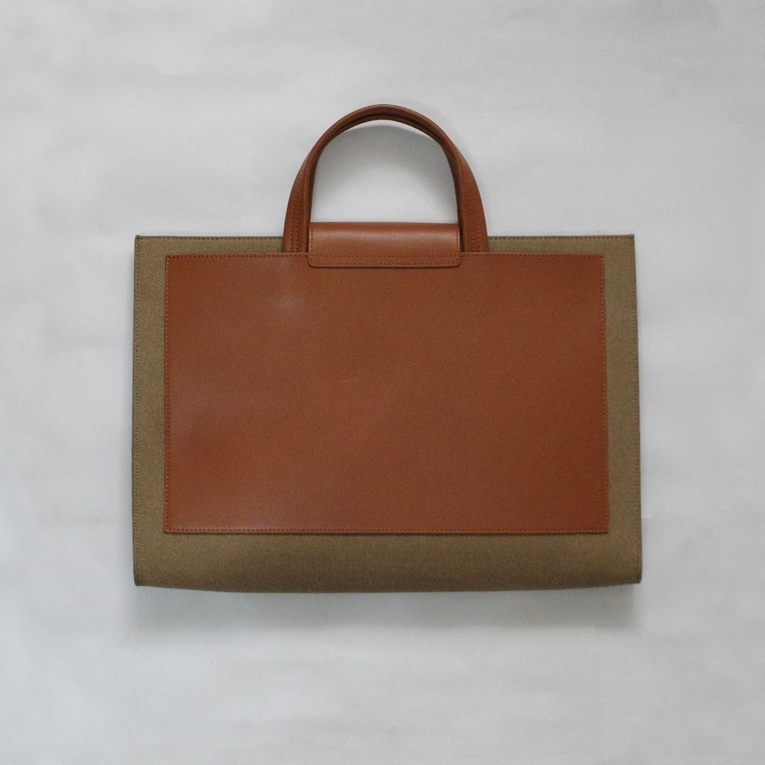 Tuscan's Leather Laptop Bag (Category: Laptop Bags & Sleeves) located in Paranaque City. Submitted by curated.by.bamekaji (Listing ID 1421694900, Image 2). Description: Tuscan's brown leather laptop bag. Features a button closure, leather handle, and tan suede interior. Multiple compartments inside. Good for 15.6" Laptop. - Minor dents on rear part leather - Good quality and worksmanship.