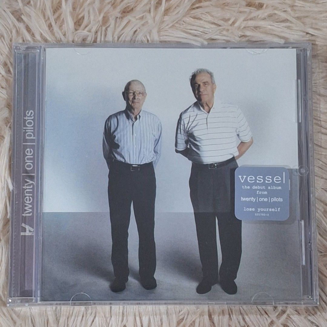 Twenty One Pilots - Vessel CD (Category: CDs & DVDs) located in Caloocan City. Submitted by collectionsitems (Listing ID 1421747334, Image 1). Description: - Twenty One Pilots' debut album, "Vessel", on CD. - Features popular tracks: "Ode to Sleep", "Holding on to You", "Migraine", "House of Gold", and "Car Radio". - In its original packaging. - Perfect for Twenty One Pilots fans!.