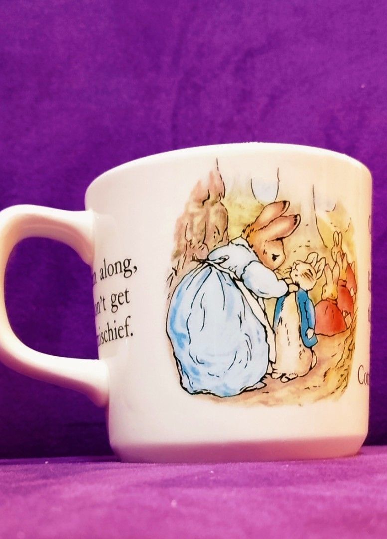 Wedgwood Peter Rabbit Mug (Category: Coffee & Tea Tableware) located in Cabanatuan. Submitted by miss.maia (Listing ID 1421762305, Image 1). Description: - Peter Rabbit mug - Features illustrations of Peter Rabbit and family - Made by Wedgwood - Made in England - Classic shape with comfortable handle - Perfect for hot beverages.
