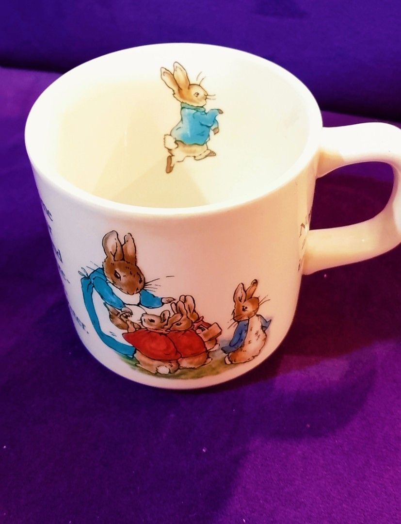 Wedgwood Peter Rabbit Mug (Category: Coffee & Tea Tableware) located in Cabanatuan. Submitted by miss.maia (Listing ID 1421762305, Image 3). Description: - Peter Rabbit mug - Features illustrations of Peter Rabbit and family - Made by Wedgwood - Made in England - Classic shape with comfortable handle - Perfect for hot beverages.