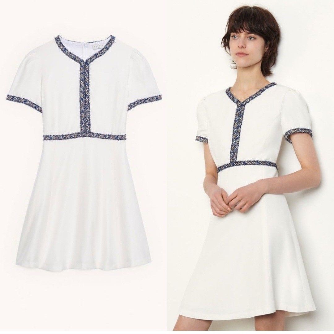 White Dress with Navy Trim (Category: Dresses) located in Makati City. Submitted by abcd2020. (Listing ID 1421719487, Image 1). Description: - White V-neck dress - Navy blue trim on neckline, sleeves, and waist - Short sleeves - Fitted bodice - Flared skirt - Versatile for casual and semi-formal events.