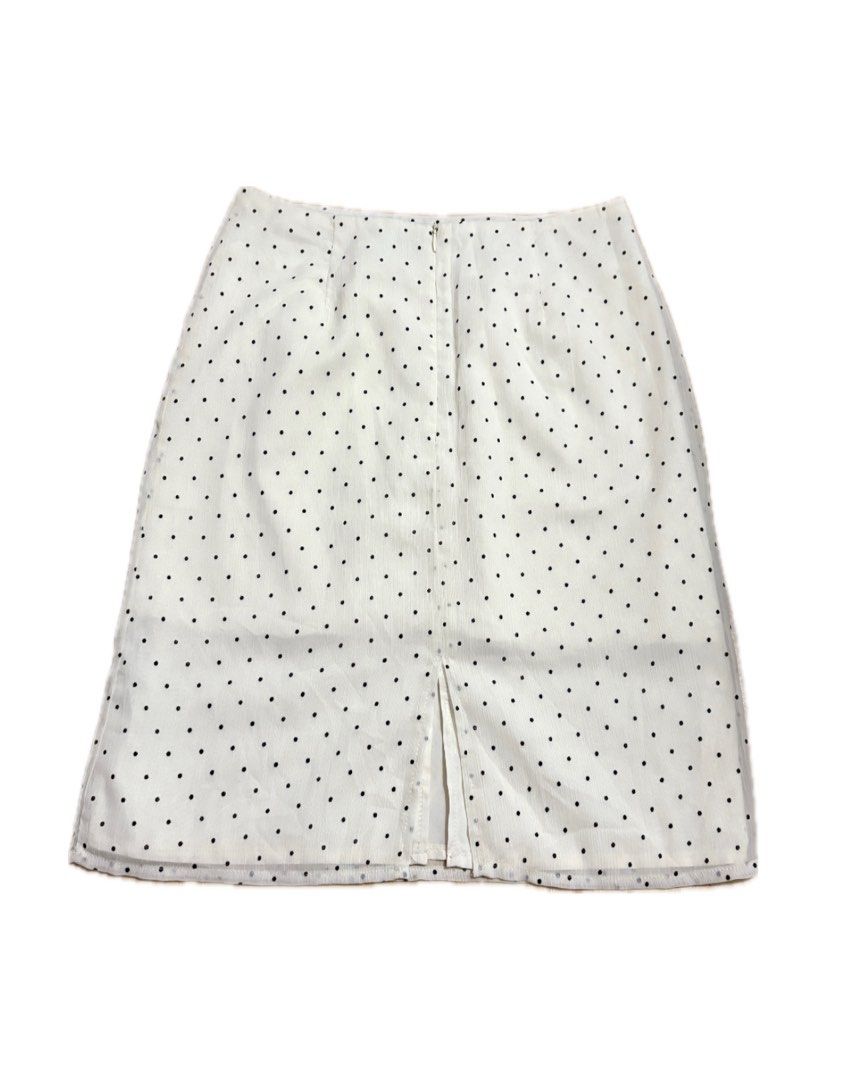 White Polka Dot Midi Skirt (Category: Skirts) located in Manila. Submitted by j_decluttering (Listing ID 1421700137, Image 2). Description: - White skirt with black polka dots - back zipper closure - slit at the bottom - nice premium lightweight fabric - super nice polka dot pattern.