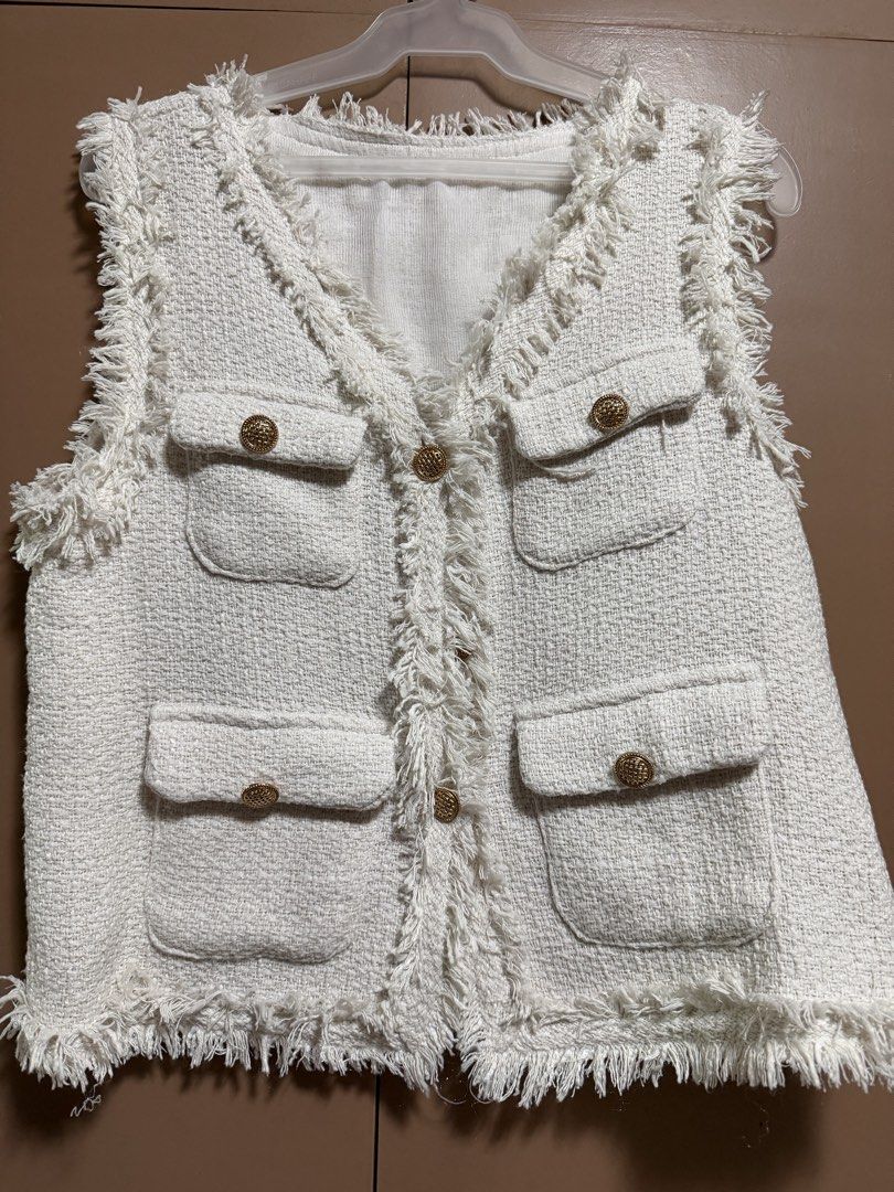 Pink Manila White Tweed Vest (Category: Sleeveless) located in Manila. Submitted by trishaaysobel (Listing ID 1421734990, Image 1). Description: - White tweed vest - V-neck design - Four front pockets - Gold-colored buttons - Fringe detailing - Sleeveless .