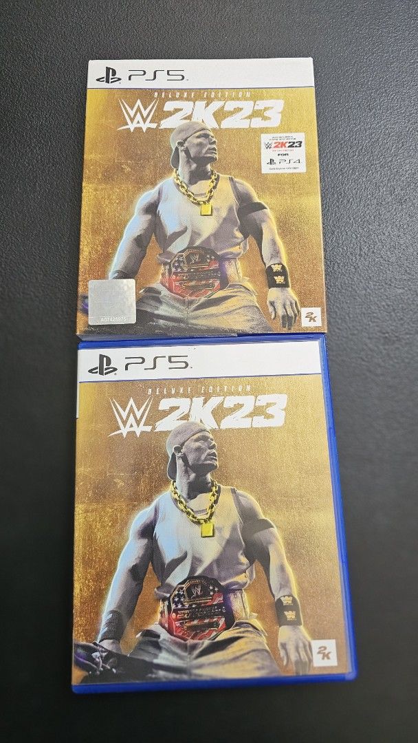 WWE 2K23 Deluxe Edition - PS5 (Category: PlayStation) located in Rizal. Submitted by dailyfindsphl (Listing ID 1421699847, Image 3). Description: WWE 2K23 Deluxe Edition for PlayStation 5. Features John Cena on the cover. Includes the game disc and bonus content. The back of the box shows various in-game screenshots. Compatible with PS4. Includes a code for the PS4 version..