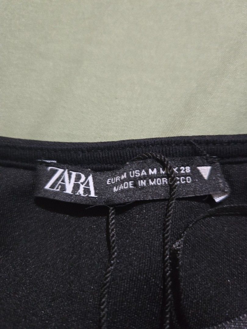 Zara Black Sleeveless - Size M (Category: Skirts) located in Makati City. Submitted by abcd2020. (Listing ID 1421723230, Image 2). Description: - Zara black skirt - Size: M - Made in Morocco - Fabric: Smooth, possibly woven - Design: Classic - Color: Black - Condition: New with tag.
