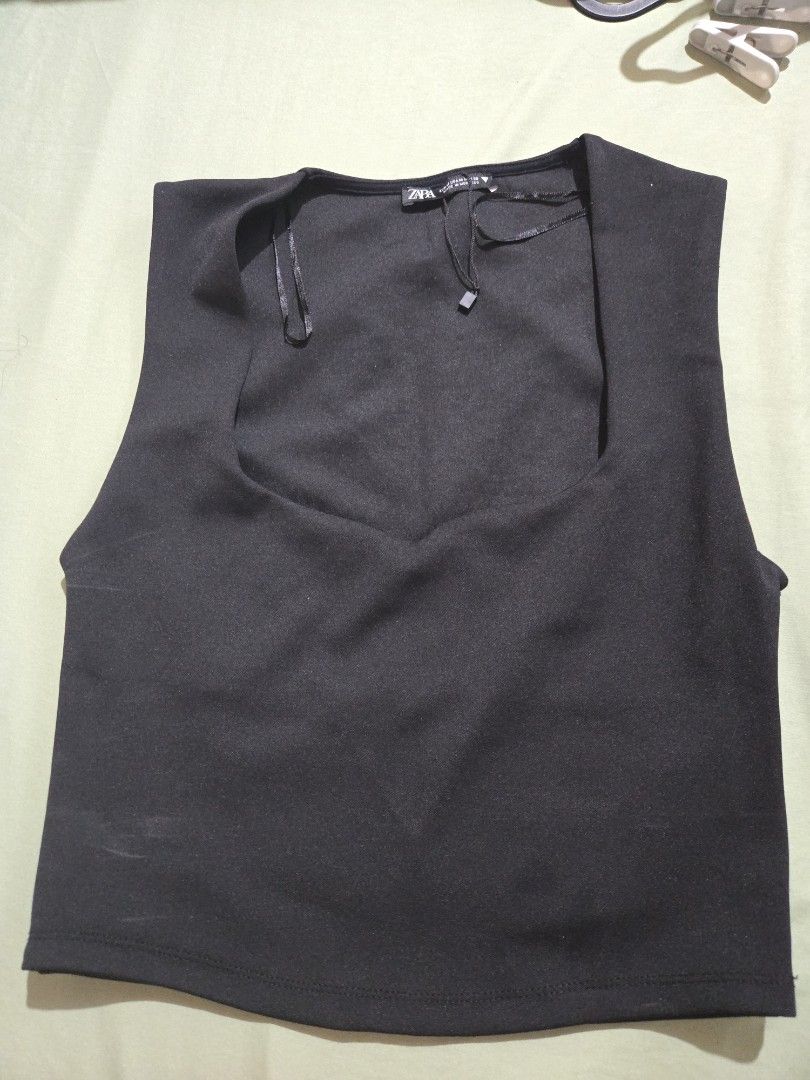 Zara Black Sleeveless - Size M (Category: Skirts) located in Makati City. Submitted by abcd2020. (Listing ID 1421723230, Image 1). Description: - Zara black skirt - Size: M - Made in Morocco - Fabric: Smooth, possibly woven - Design: Classic - Color: Black - Condition: New with tag.