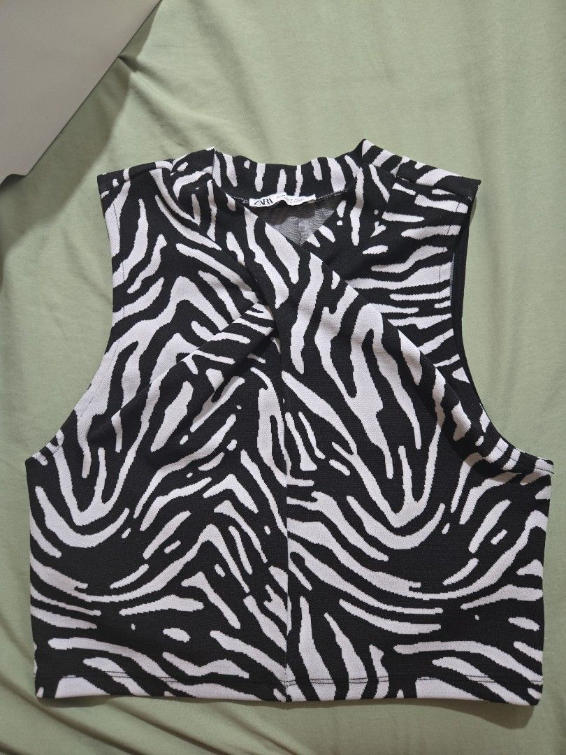 Zara Zebra Print Top (Category: Sleeveless) located in Makati City. Submitted by abcd2020. (Listing ID 1421716965, Image 1). Description: - Zara zebra print top - Size: M - Asymmetrical design - Made in Turkey - Adds a statement to your outfit.