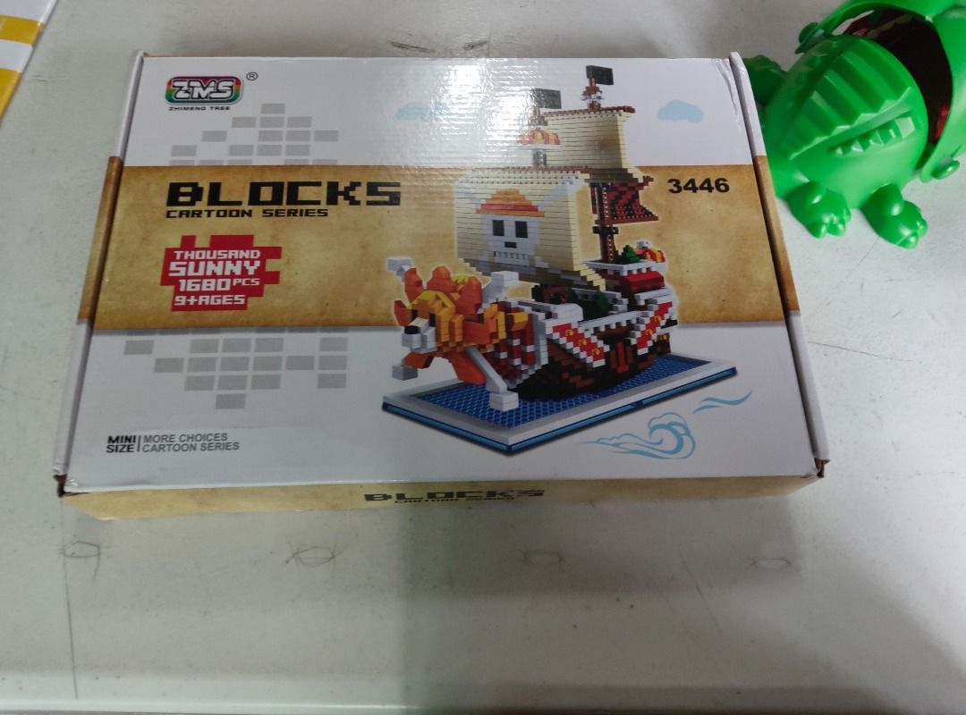ZMS Blocks Thousand Sunny Ship (Category: Lego & Building Sets) located in Quezon City. Submitted by gcnt_trift_store (Listing ID 1421690964, Image 1). Description: - ZMS Blocks Thousand Sunny building block set. - Over 1680+ pieces. - Mini size. - Suitable for ages 9+. - Features the Thousand Sunny ship with skull design and lion figurehead..