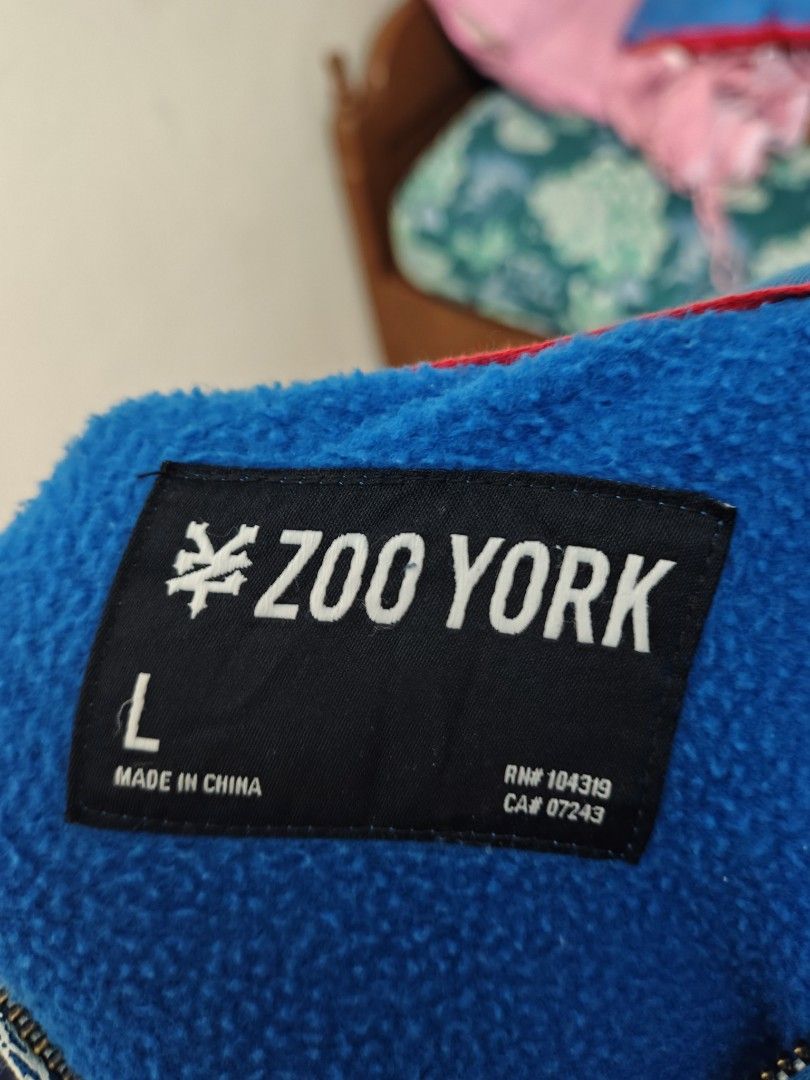 Zoo York Blue Hoodie (Category: Hoodies) located in Don Carlos. Submitted by ej_yap-cambil.19 (Listing ID 1421730108, Image 2). Description: - Zoo York hoodie - Size: L -Length: 28inches -Width: 30inches - Color: Blue - Features a full zip closure - Design: Printed on the front - Material: Soft, fleece-like fabric - Made in China - Brand: Zoo York.