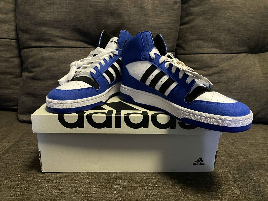 Adidas Break Start Mid Shoes (Category: Sneakers) located in Rizal. Submitted by TheRetailAddict (Listing ID 1421868590, Image 3). Description: Adidas Hoops Mid 2.0 sneakers in blue and white. Features the iconic Adidas stripes in black. The shoes are high-top style with a white sole. Comes with the original box. The shoes appear to be unworn..