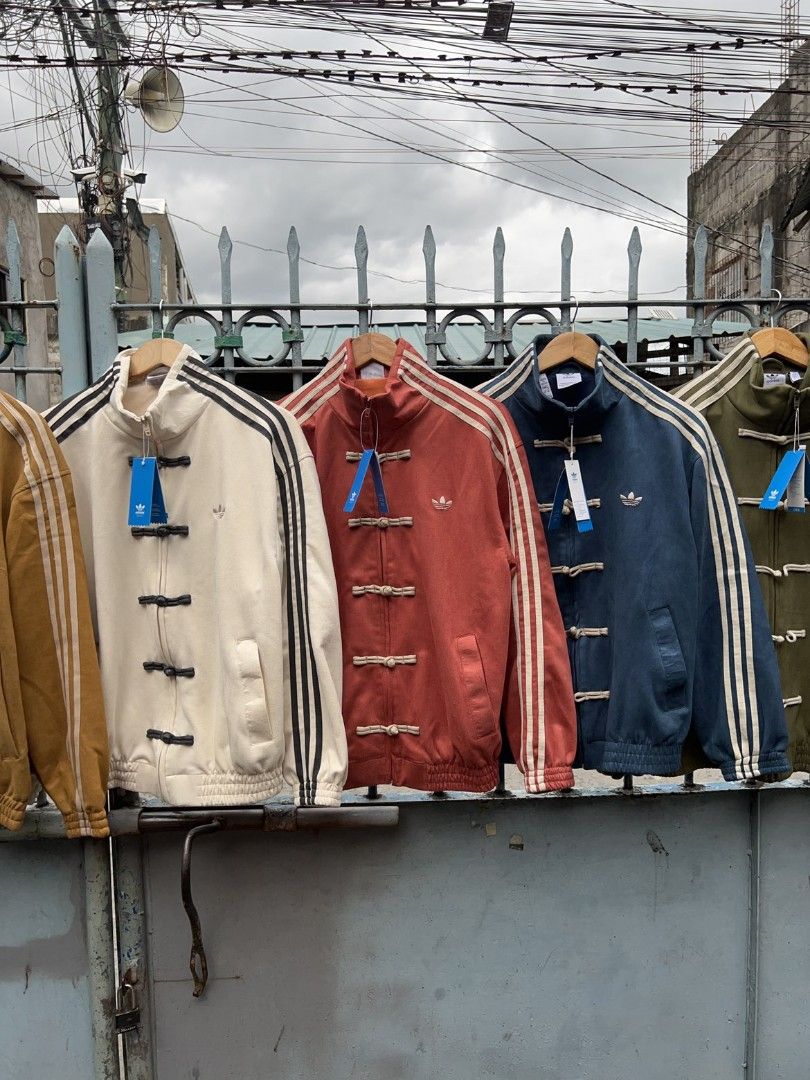 ADIDAS CHINESE NEW YEAR JACKET (Category: Coats, Jackets and Outerwear) located in Taguig. Submitted by patrickbas46594 (Listing ID 1421876932, Image 2). Description: 𝐁𝐑𝐀𝐍𝐃𝐍𝐄𝐖 𝐖𝐈𝐓𝐇 𝐇𝐀𝐍𝐆𝐓𝐀𝐆 ‼️ Limited sizes available onhand 📌 PRE ORDER AVAILABLE FOR UNAVAILABLE SIZES/COLOR | XS - 2XL | ✔️ Sizes onhand: S | M | L | XL | •Sizes & price depends on the color of the jacket TAGUIG LOWER BICUTAN 📍 DM ME FOR MORE DETAILS 📩.