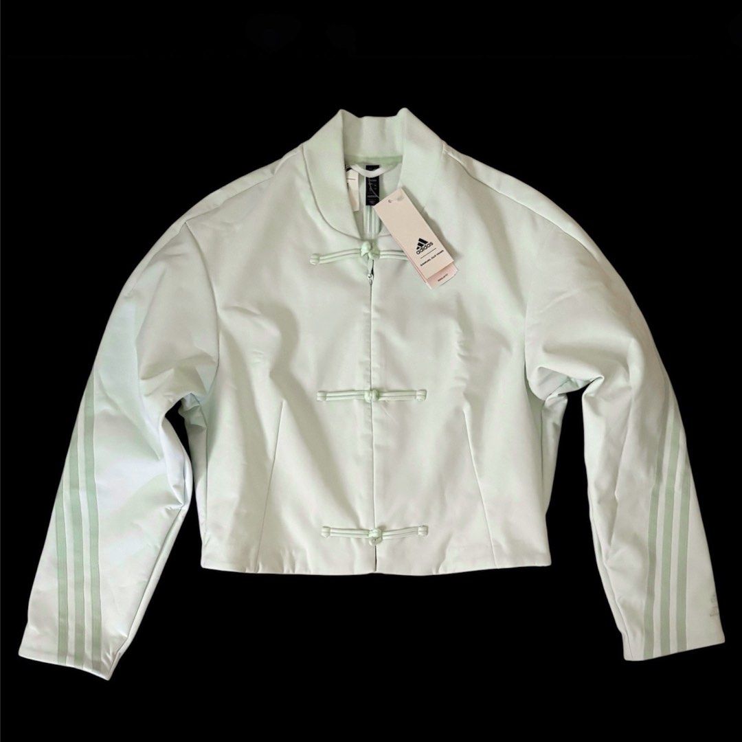Adidas CNY Samuel Gui Yang Jacket (Category: Coats, Jackets and Outerwear) located in Taguig. Submitted by random.objects (Listing ID 1421868878, Image 1). Description: Adidas x Samuel Gui Yang collaboration jacket CNY Chinese New Year 2024 - brand new with tags - 💯 authentic - Light mint green - Mandarin collar, three stripes on sleeves and back, cropped fit - Features zipper closure, toggle details - Size: XL - fits medium to large (dimensions