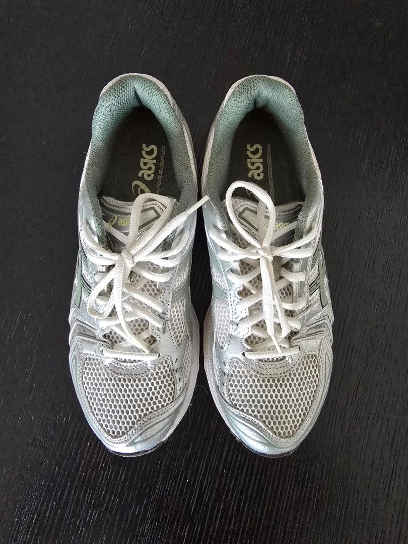Asics Gel-Kayano 14 Running Shoes - Size 9 (Category: Sneakers) located in Singapore. Submitted by btichboy (Listing ID 1421809349, Image 2). Description: - Asics Gel-Kayano 14 - Silver and green colorway - Size: US 9, UK 8, EUR 42.5 - Made in Vietnam - Suitable for running or casual wear.