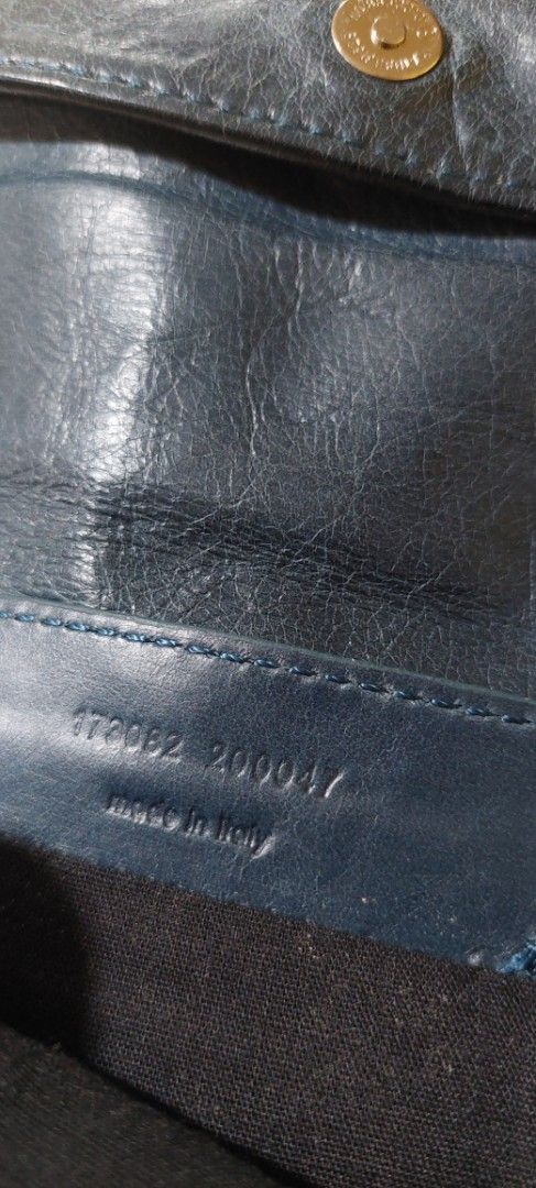 Balenciaga Leather Wallet (Category: Luxury Bags & Wallets) located in Manila. Submitted by aabila (Listing ID 1421903289, Image 3). Description: - Balenciaga envelope clutch - Blue leather - Zip closure - Multiple compartments - Front zipper pocket - Snap closure - Brand logo - 'Made in Italy' label.