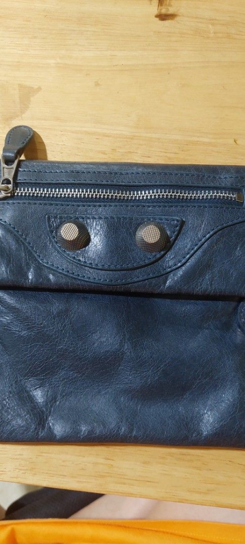 Balenciaga Leather Wallet (Category: Luxury Bags & Wallets) located in Manila. Submitted by aabila (Listing ID 1421903289, Image 1). Description: - Balenciaga envelope clutch - Blue leather - Zip closure - Multiple compartments - Front zipper pocket - Snap closure - Brand logo - 'Made in Italy' label.