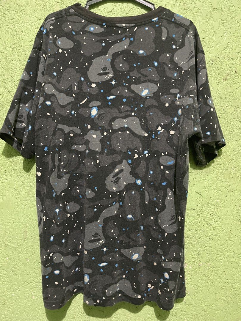 BAPE Galaxy Camo T-shirt (Category: Tshirts & Polo Shirts ) located in Bacolod City. Submitted by 1012.thrift (Listing ID 1421836195, Image 2). Description: -21x27 - Authentic BAPE T-shirt - Size: M - Design: Galaxy camo - Features the Ape Head logo - Colors: Dark grey, black, white, and blue accents - BAPE logo color: Light green - Issue: discoloration in neck line -1499 free ship -pwede fb transac thru vc.