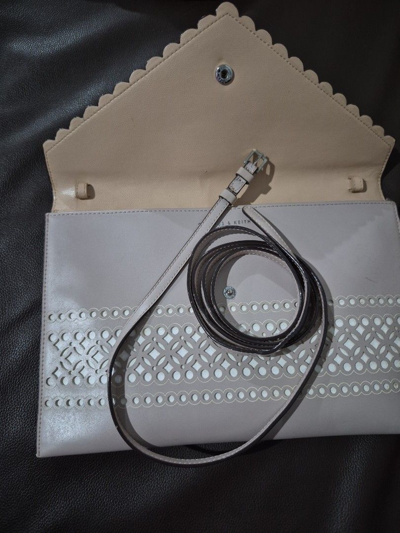 Charles and Keith Beige Clutch Bag with Strap (Category: Clutches) located in Cainta. Submitted by jastampes (Listing ID 1421893060, Image 3). Description: envelope style, 3 compartment clutch or shoulder bag. no flaws .