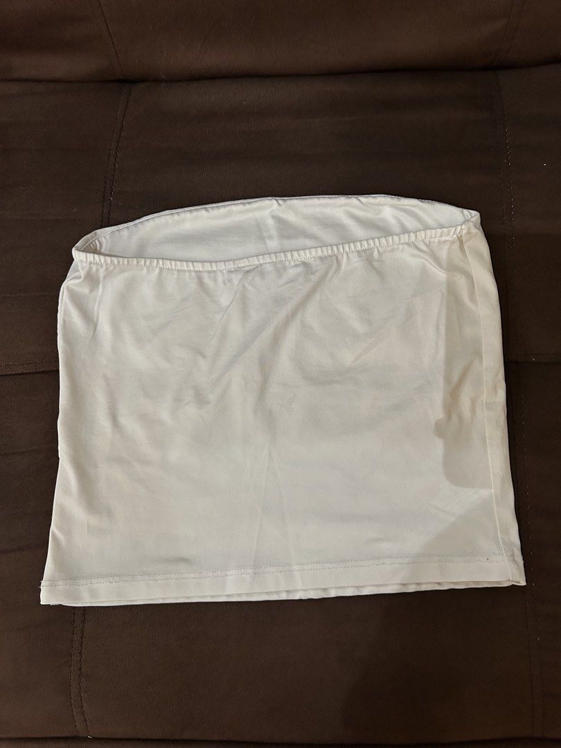 Bershka White Tube Top (Category: Sleeveless) located in Pasig City. Submitted by gdeclutterwithme (Listing ID 1421906190, Image 2). Description: - Bershka white tube top - Size: EUR S, USA S, MEX 28 - Silky fabric - stretchable so dw!! it'll fit fitted hihi - 11.8 x 11 inches dm for more details!!.