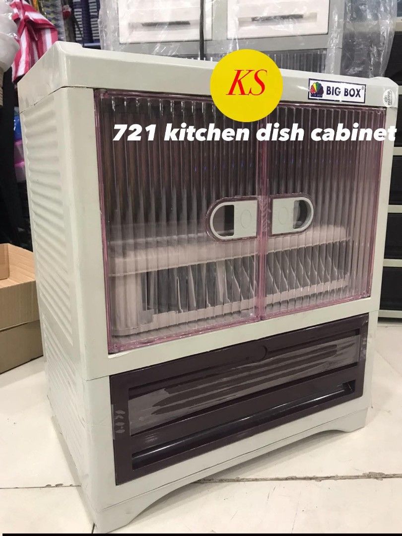 Big Box 721 Kitchen Dish Cabinet (Category: Other Kitchenware & Tableware) located in Taguig. Submitted by diannecaya86853 (Listing ID 1421918465, Image 2). Description: Big Box 721 kitchen dish cabinet is designed for storing dishes. It features a two-door cabinet with a dish rack and a drawer at the bottom. The cabinet has a clear front, allowing visibility of the contents. It is suitable for kitchen use..