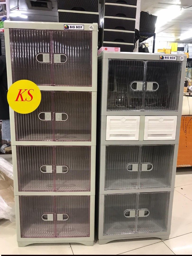 Big Box Storage Cabinet #742 and #540 (Category: Shelves, Cabinets & Racks) located in Taguig. Submitted by diannecaya86853 (Listing ID 1421917542, Image 2). Description: - Durable Big Box storage cabinets - Multiple compartments with transparent doors - Available colors: - Light gray with pinkish doors - Gray with white drawers - Features handles for easy opening - Ideal for home and office organization.
