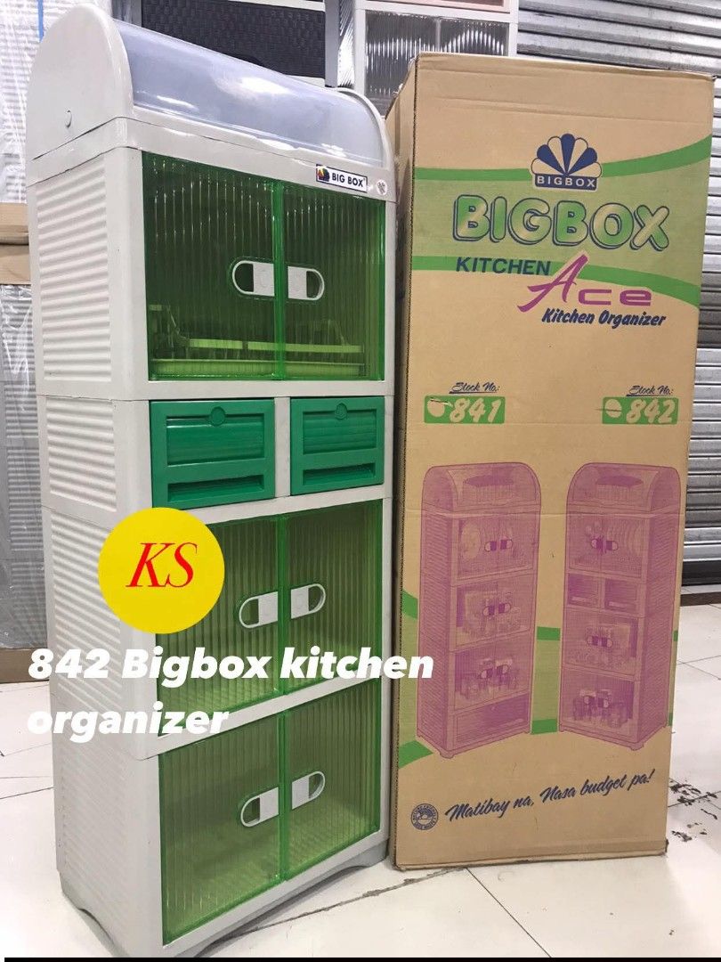 Bigbox Kitchen Ace 842 Kitchen Organizer (Category: Food Organization & Storage) located in Taguig. Submitted by diannecaya86853 (Listing ID 1421917818, Image 3). Description: Bigbox Kitchen Ace 842 kitchen organizer. It has a green and white color scheme. The organizer features two drawers and two cabinet doors. The product is new and still in its original packaging..